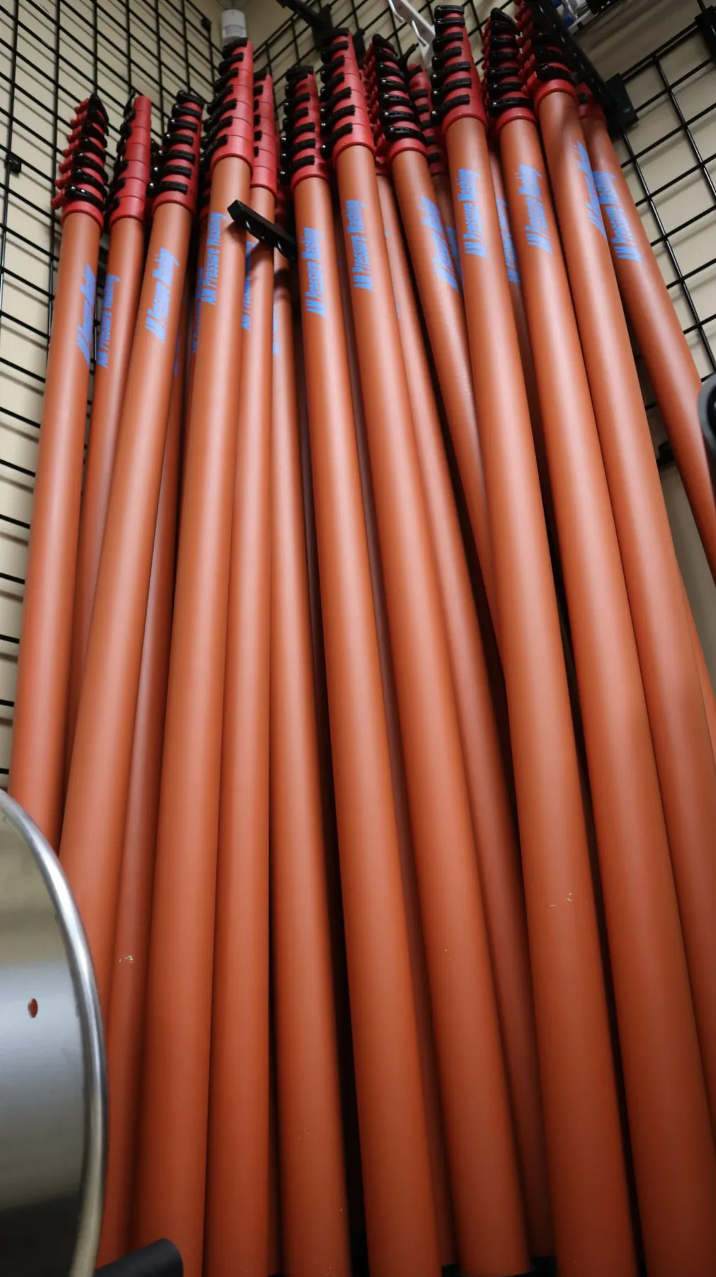 AMPW oval poles stacked on rack