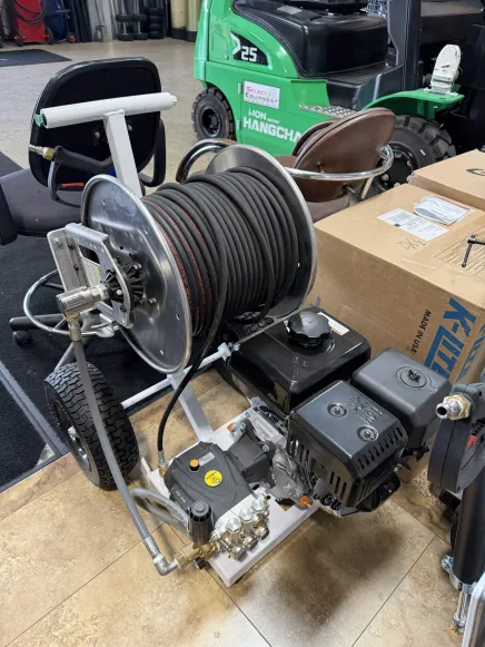 Portable pressure washer with hose reel